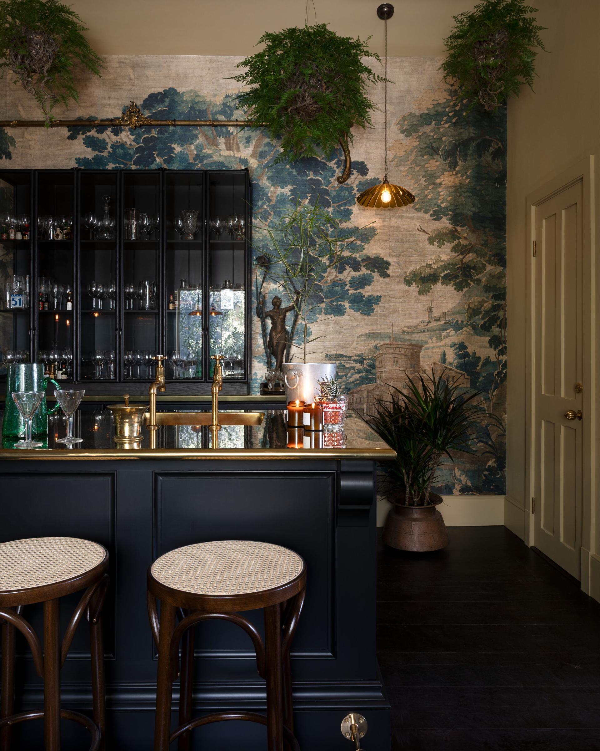 Black painted Haberdasher's furniture in a luxurious private bar.