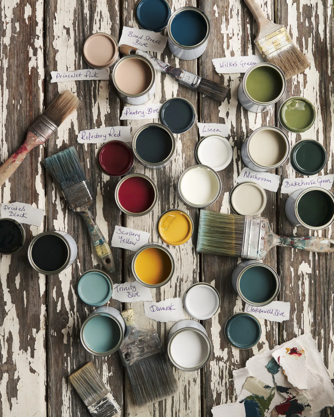 Top-down view of deVOL paint tins open to show colours 